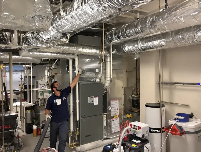 Kingston Air Duct Cleaning specialist performing thorough furnace duct cleaning in a Kingston residence