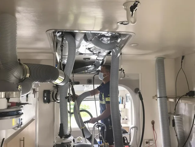 Kingston Air Duct Cleaning specialist performing precise mobile home duct cleaning in Kingston