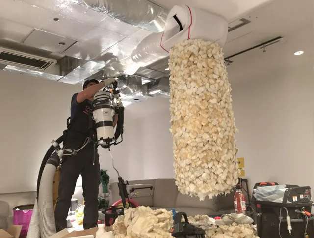 Kingston Air Duct Cleaning technician performing precision vacuum insulation removal in a residential property in Kingston