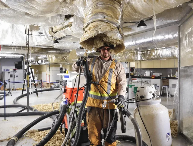 Professional vacuum insulation removal by Kingston Air Duct Cleaning expert in Kingston
